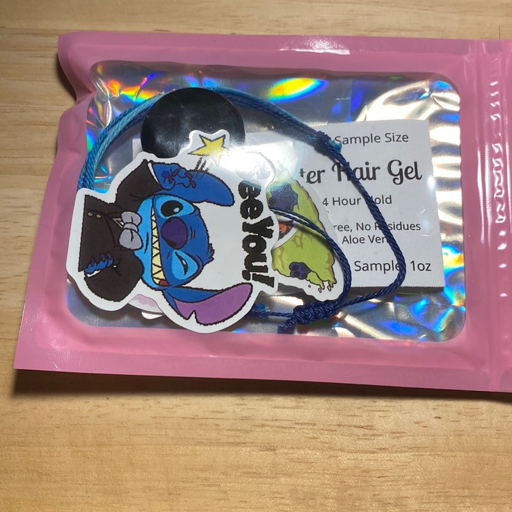 i am selling a sample of glitter hair gel ,2 stickers and a bracelet!!